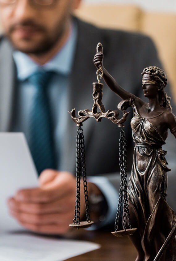 close up view of lady justice statue and lawyer wo RE8YGXA.jpg