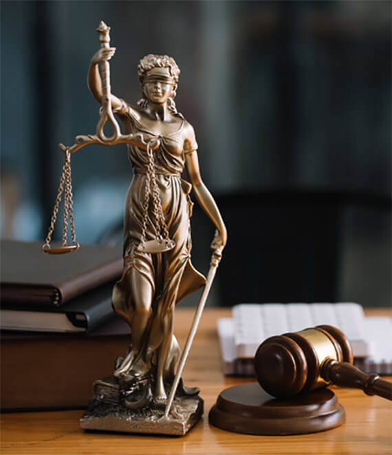 statue of lady justice on desk of a judge or lawye SVECXT5 intro.jpg